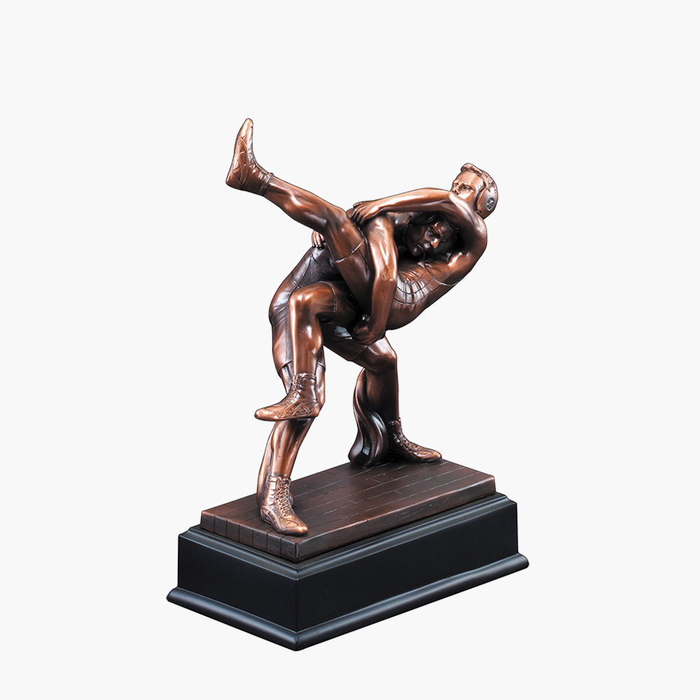 about 8" high wrestling trophy wrestler featured headgear with engraving 